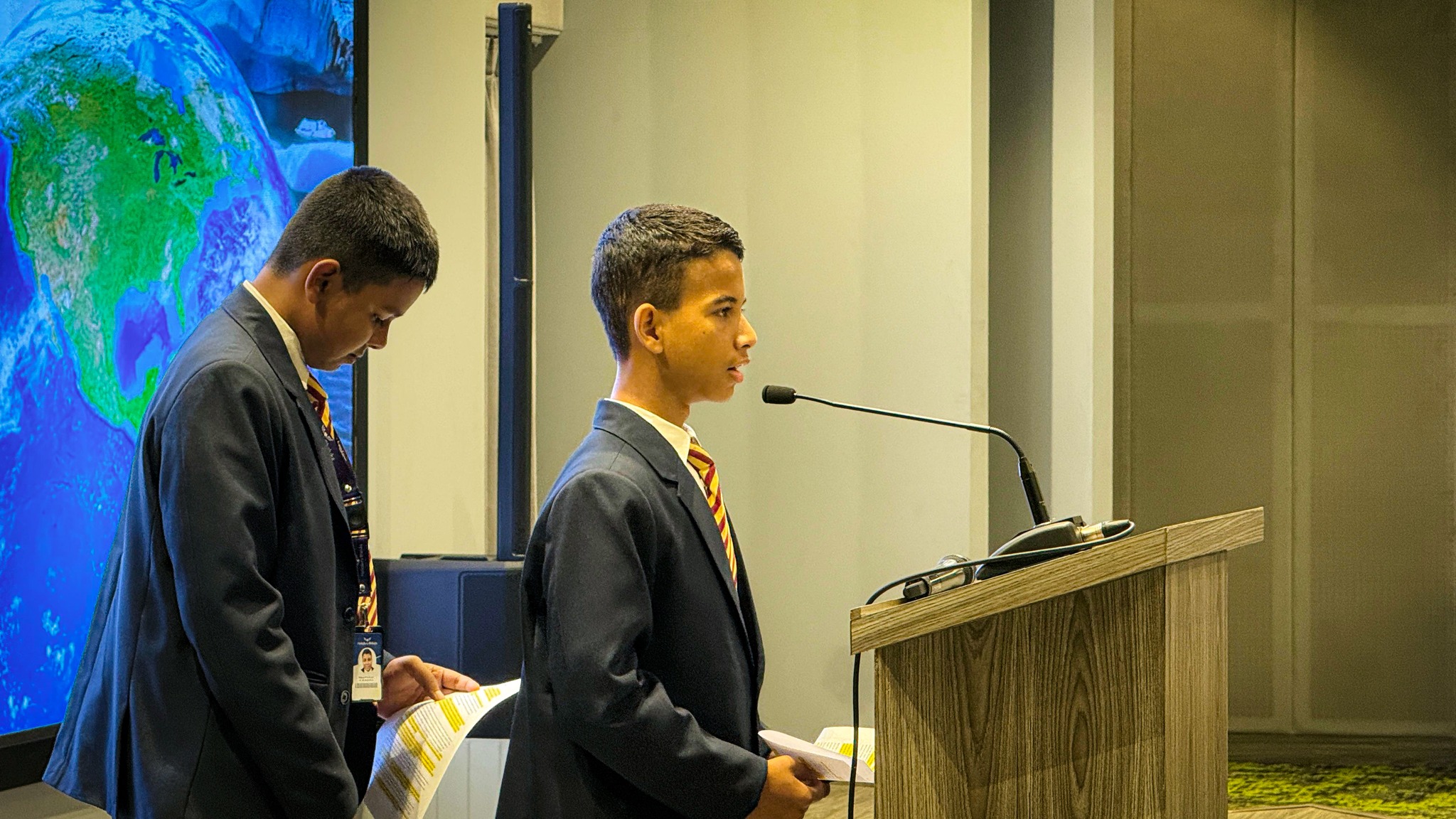 Students presenting speeches on climate awareness, resilience, and mental well-being at Haileybury Bhaluka assembly