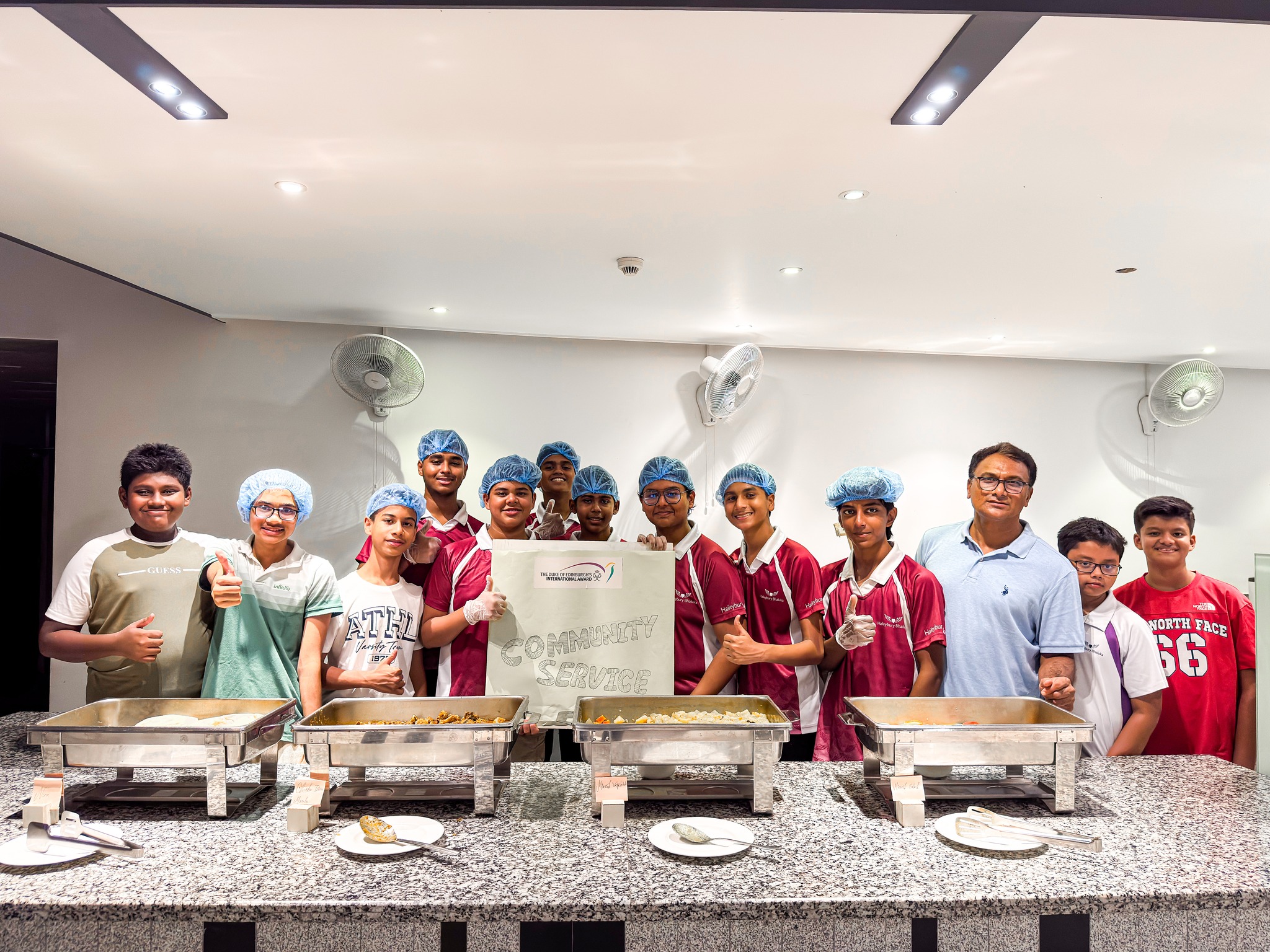 Haileybury Bhaluka students participating in a community service dinner event for the Duke of Edinburgh Award.